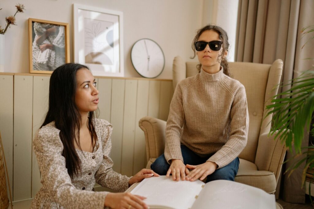 Blind woman receiving assistance